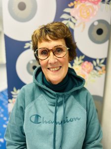 Woman in new glasses from Stotts Opticians Urmston wearing Coco Song designer frames